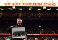Sir Alex Ferguson is presented with a photo to commemerate his 25th year as manager, as the North Stand is renamed the 'Sir Alex Ferguson Stand' during the Barclays Premier League match between Manchester United and Sunderland at Old Trafford on November 5, 2011 in Manchester, England.  (Photo by Richard Heathcote/Getty Images)